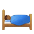 🛌🏾 person in bed: medium-dark skin tone display on Samsung